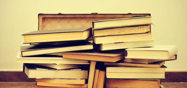 A,Pile,Of,Books,In,An,Old,Suitcase,With,A